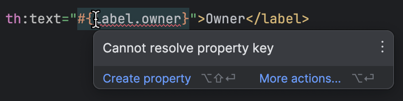 IntelliJ IDEA shows a warning in the template that references a missing property key